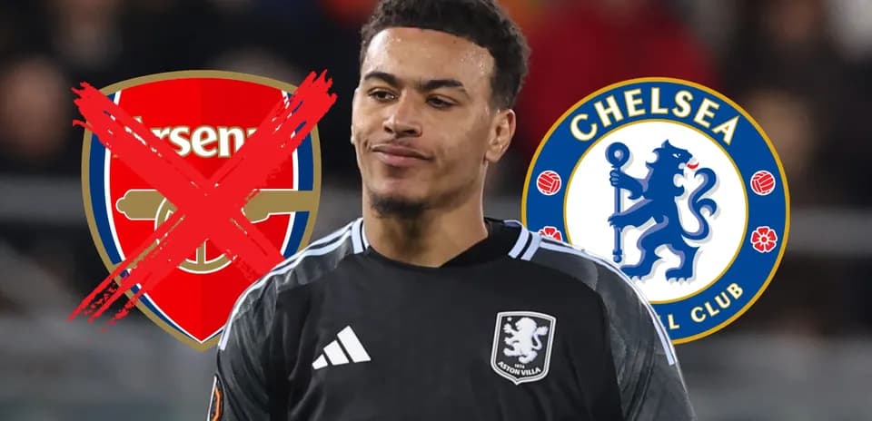 Player in goalkeeper kit with club logos behind