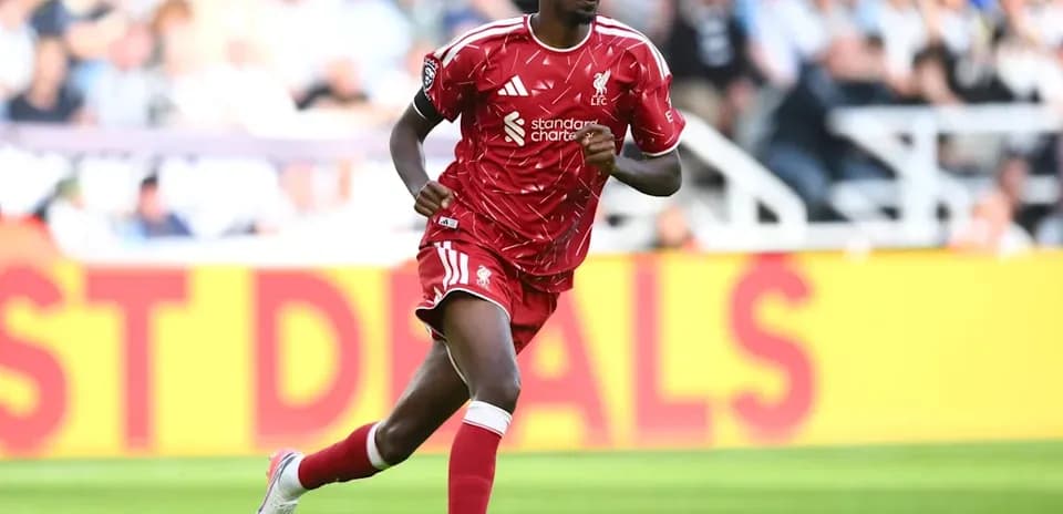 Player running during match in red Liverpool kit