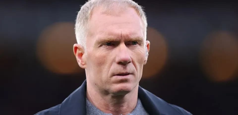 Close-up of a man with short hair and serious expression