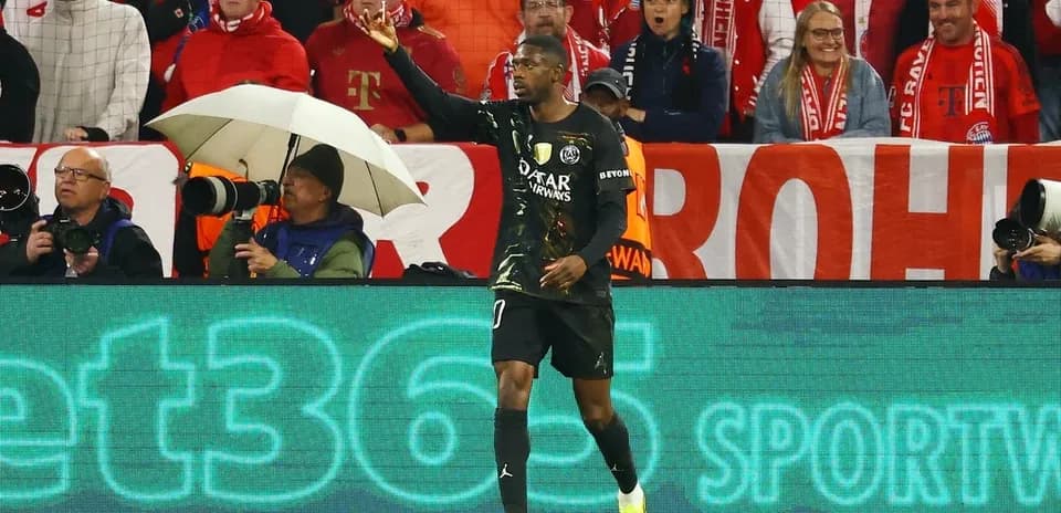 Goalkeeper gesturing during match with fans in background