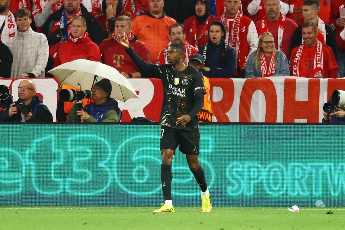 Goalkeeper gesturing during match with fans in background
