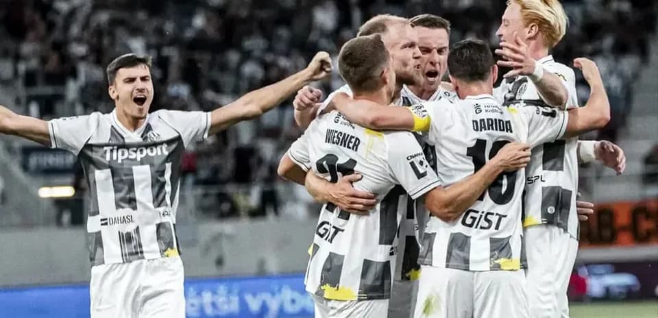 Players celebrating a goal during the match