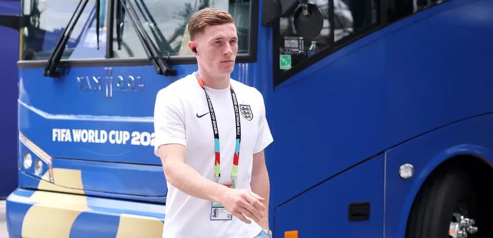 Player walking near FIFA World Cup team bus