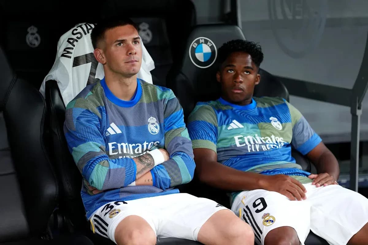 Two Real Madrid players seated on the bench