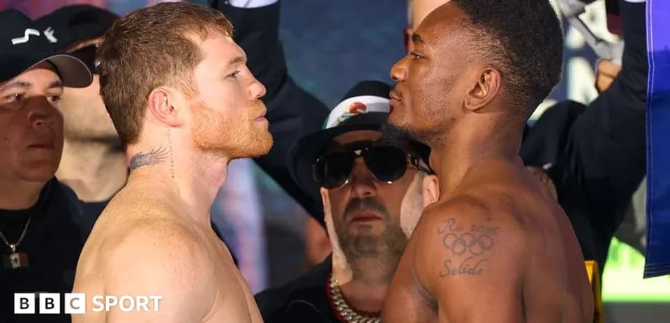 Two boxers facing off at weigh-in event