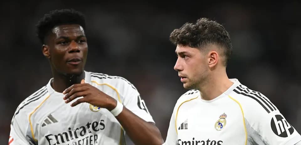 Two Real Madrid players discussing on the pitch