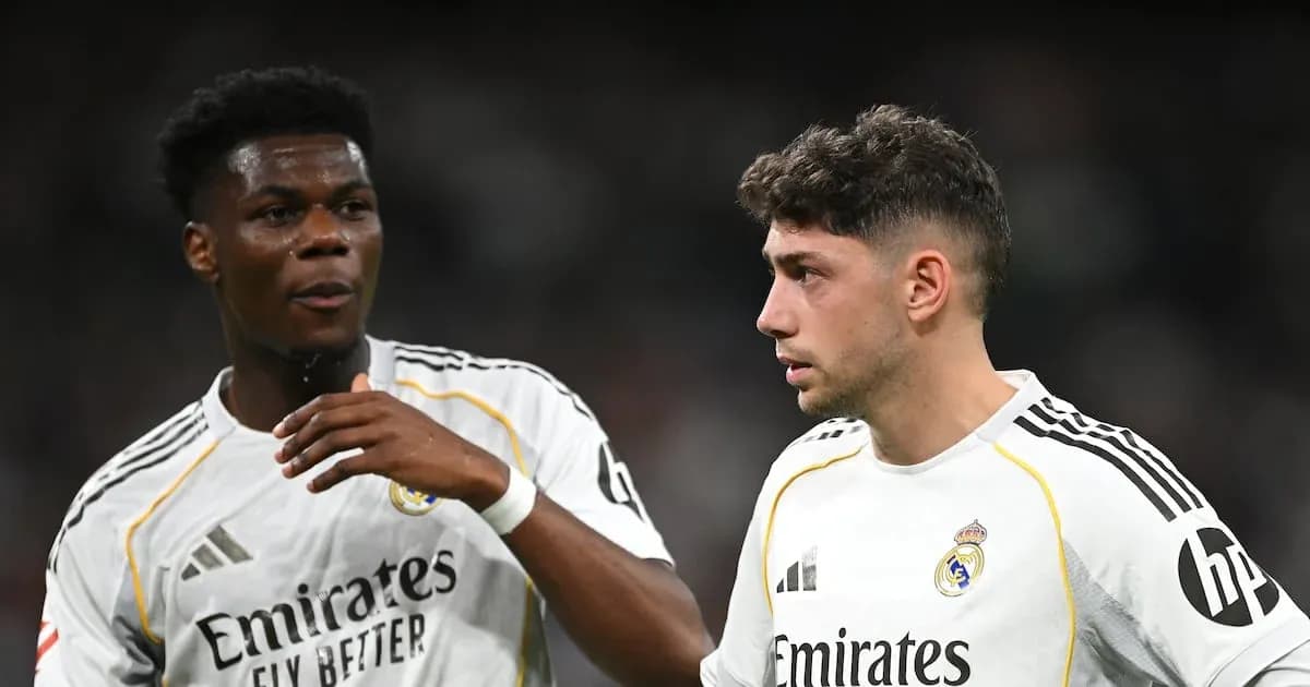 Two Real Madrid players discussing on the pitch