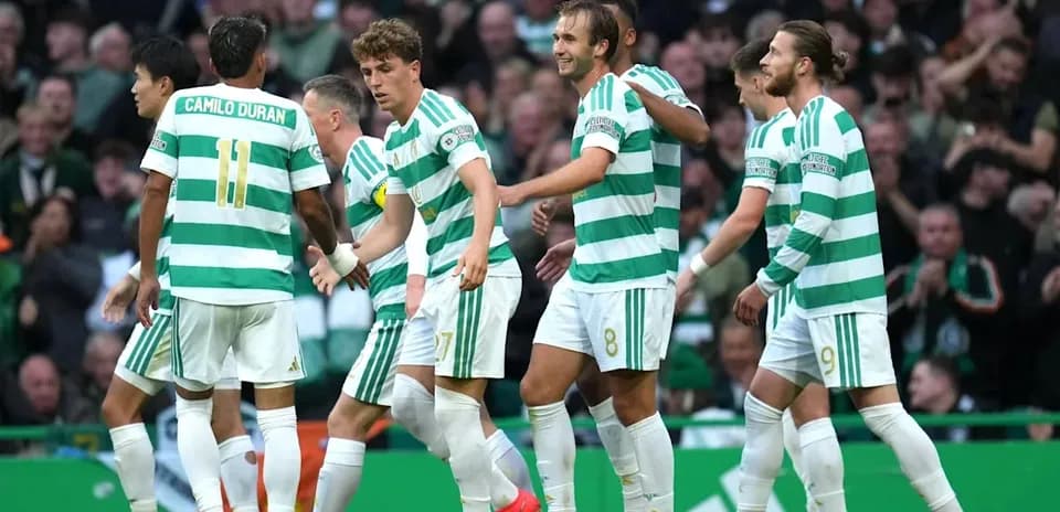 Celtic players celebrating a goal together