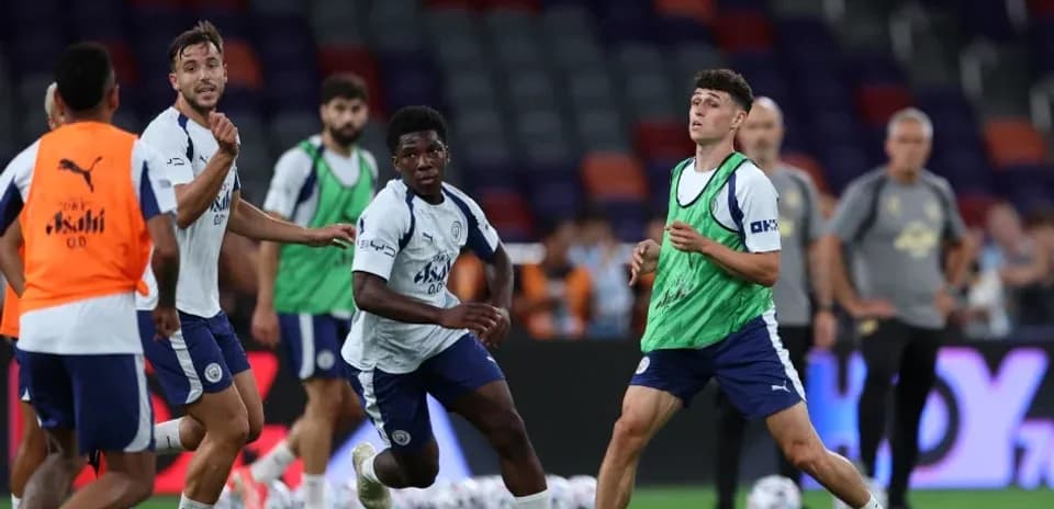 Players training and practicing ball control on pitch