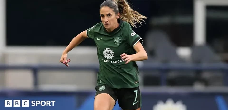 Player in green kit running on the field