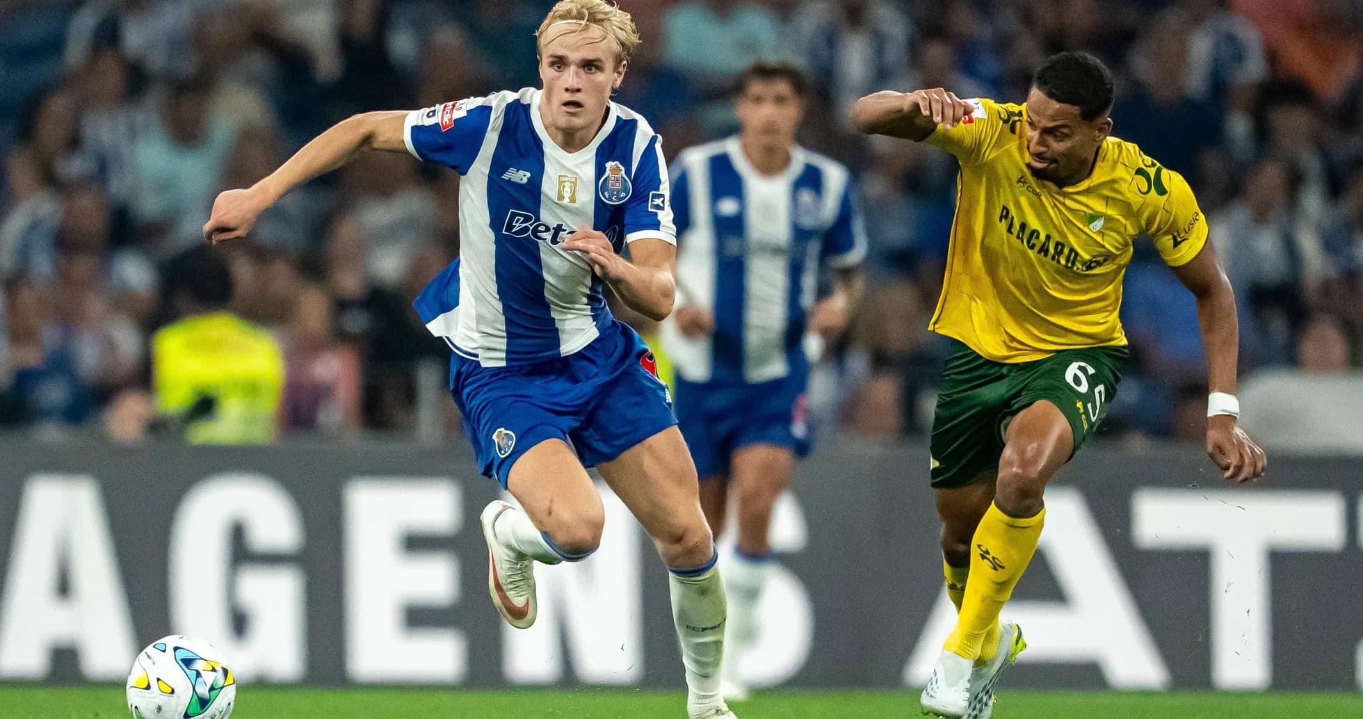 Player sprinting with ball during football match