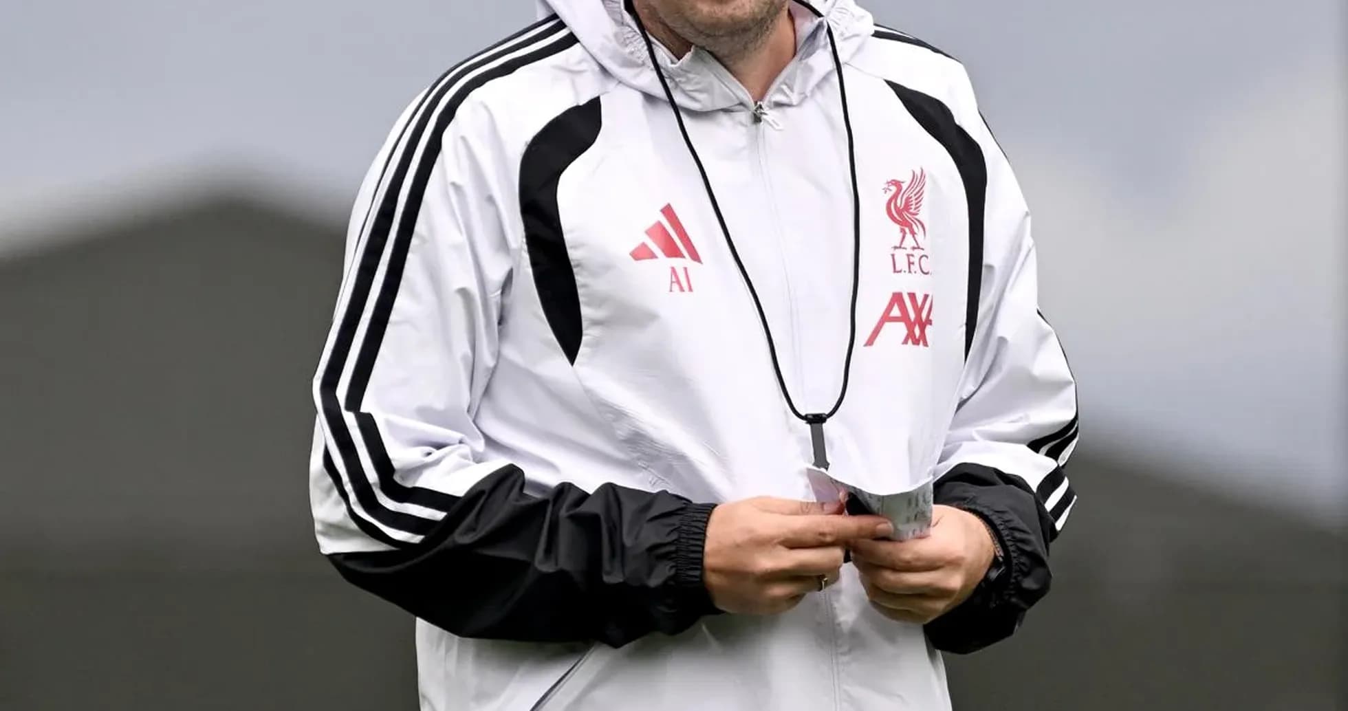 Coach smiling during training session at Liverpool FC