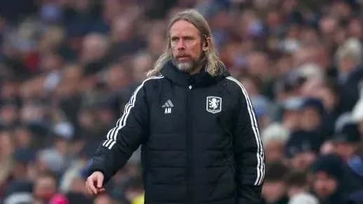 Manager on the sidelines during a football match