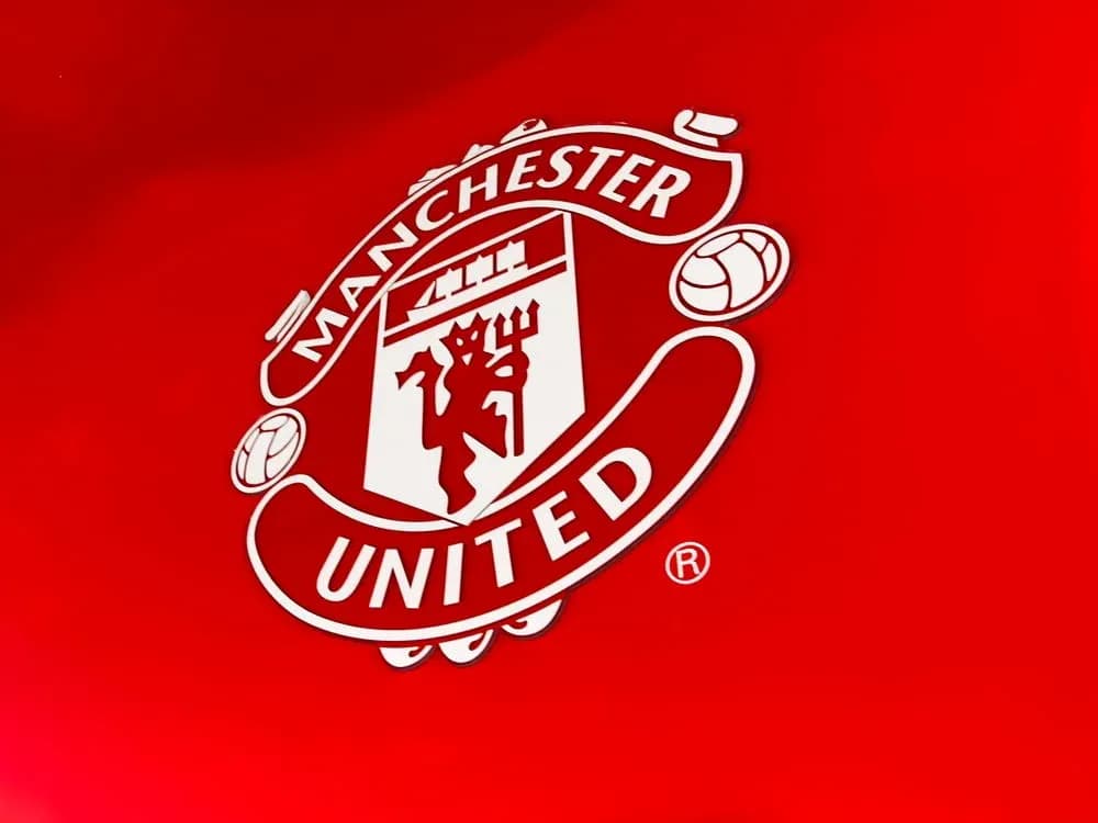 Manchester United club logo on red background