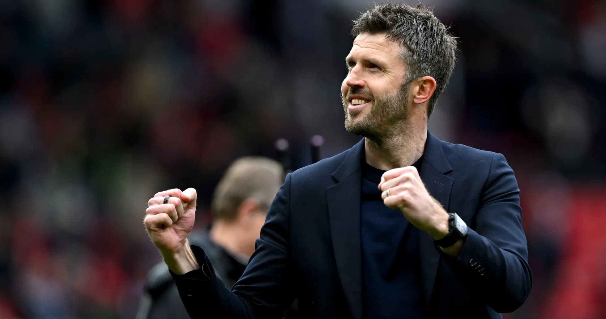 Manager celebrating victory with clenched fists