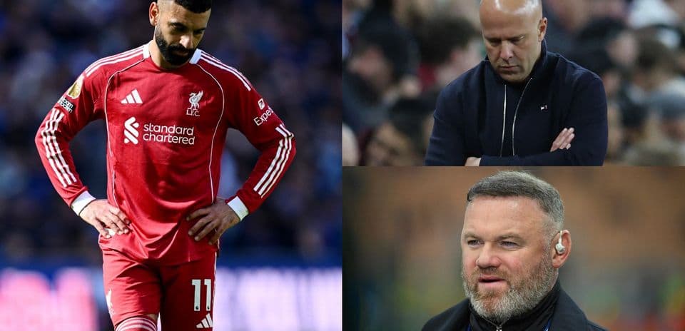 Liverpool player looking down, coaches observing match
