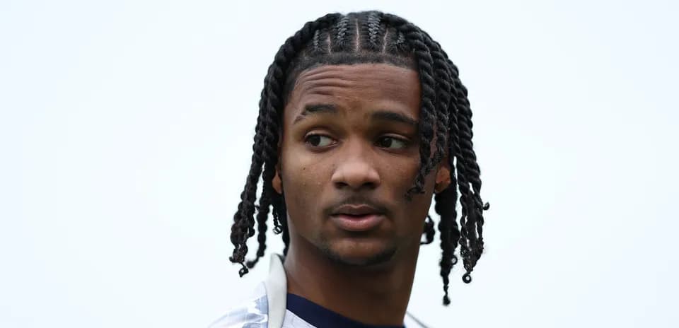 Young athlete with braided hair looking to the side
