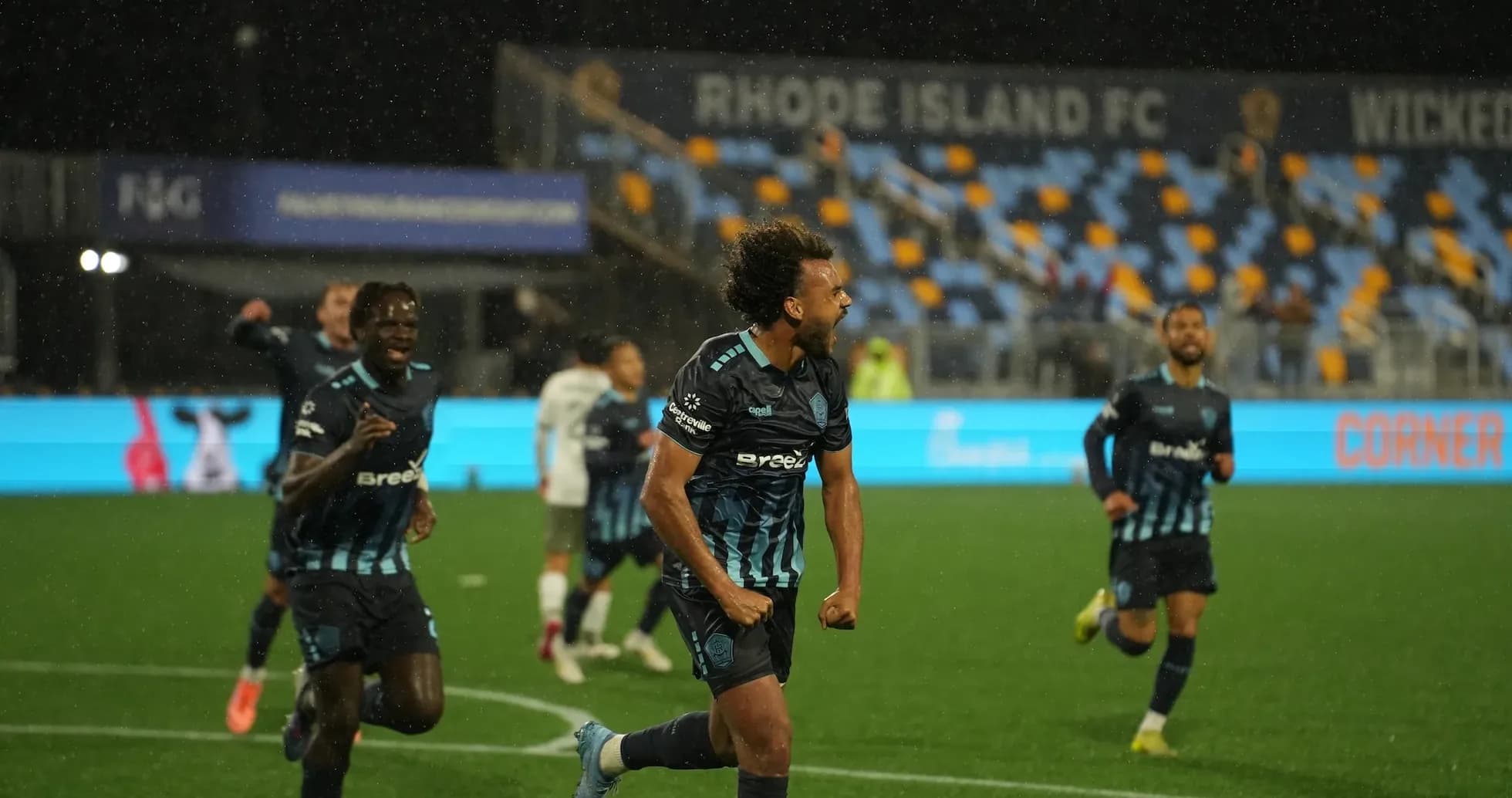 Rhode Island players celebrating a goal