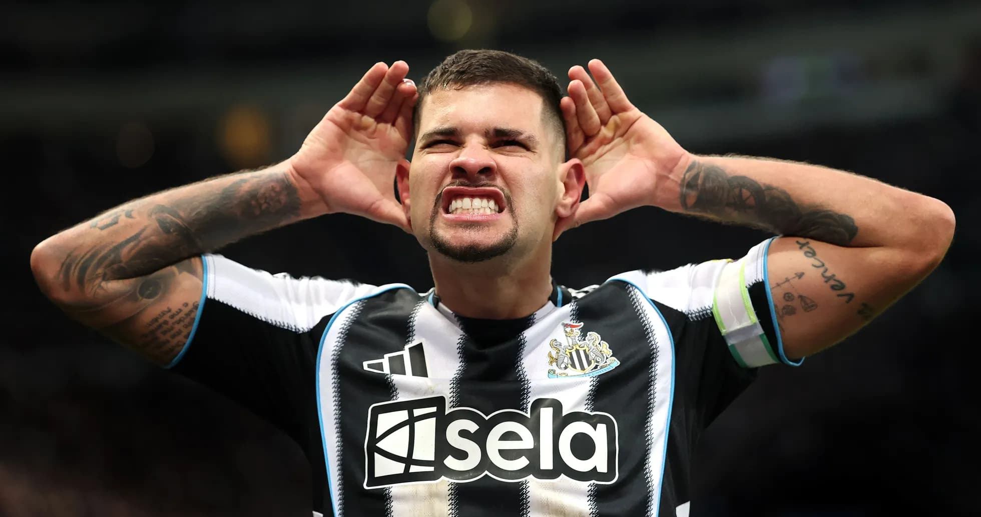 Player celebrating with hands on ears during match