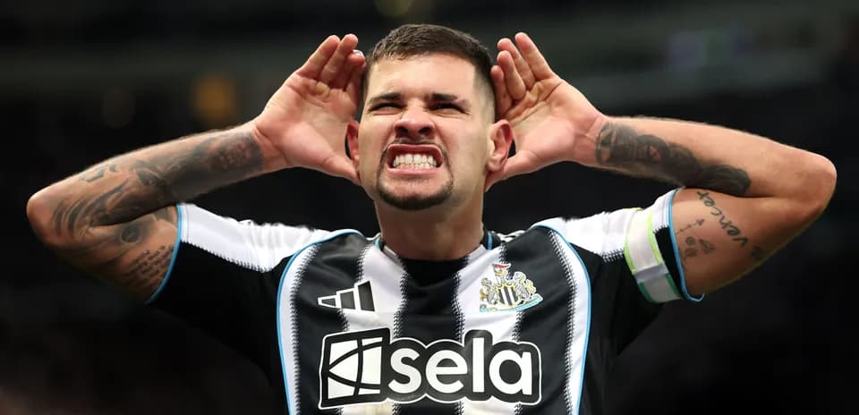 Player celebrating with hands on ears during match