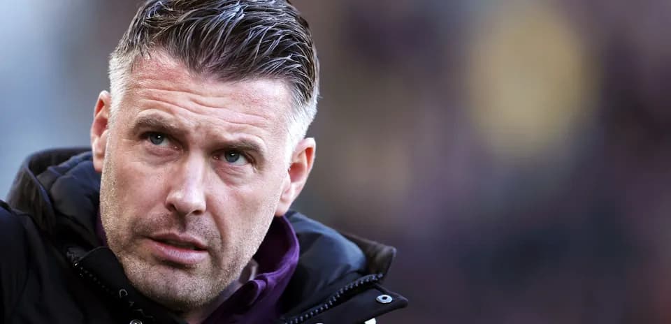 Coach looking focused during match on sideline