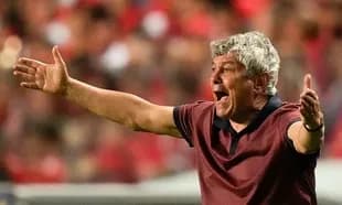 Coach gesturing passionately during match on sidelines