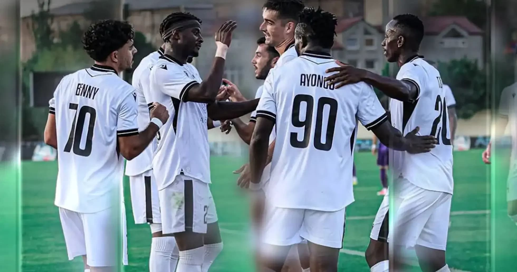 Players celebrating a goal during match