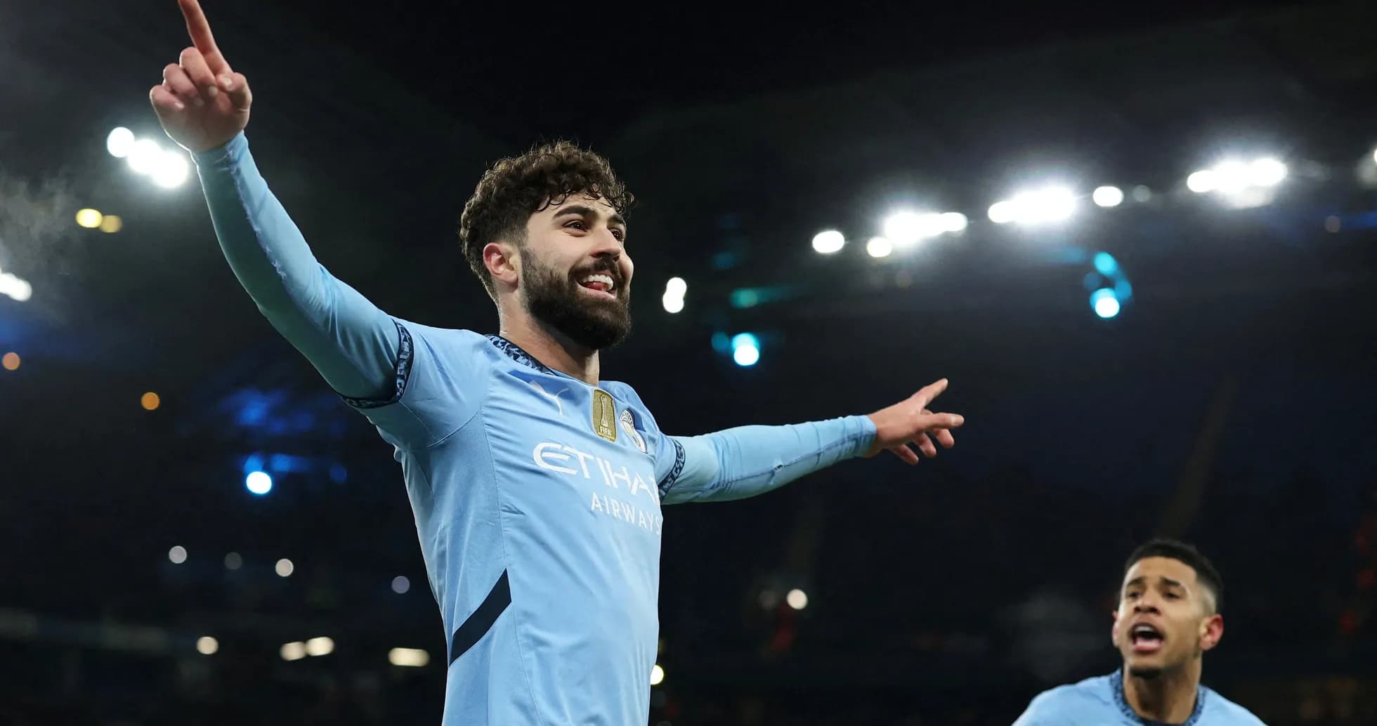 Manchester City player celebrating a goal