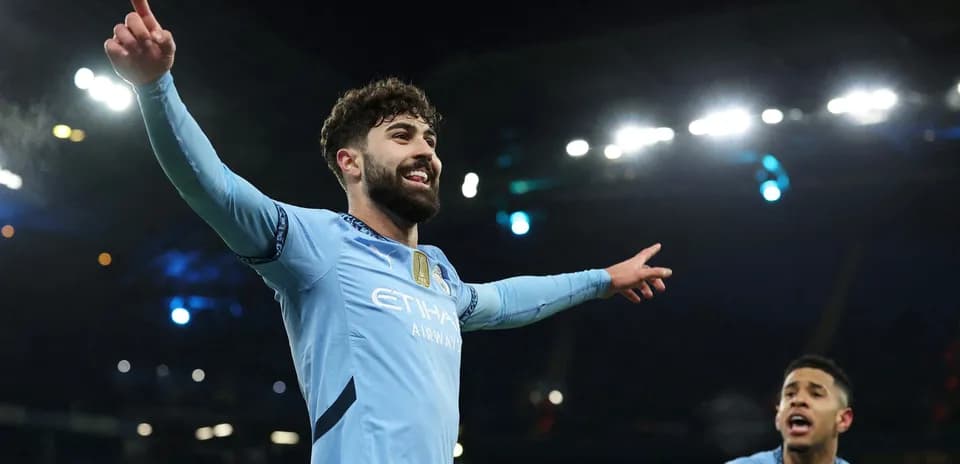 Manchester City player celebrating a goal
