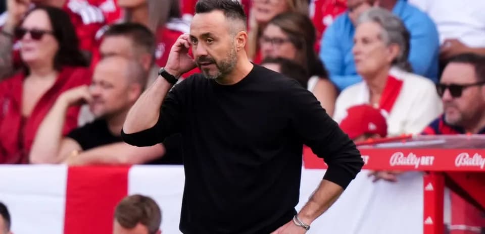 Coach on sidelines during a football match
