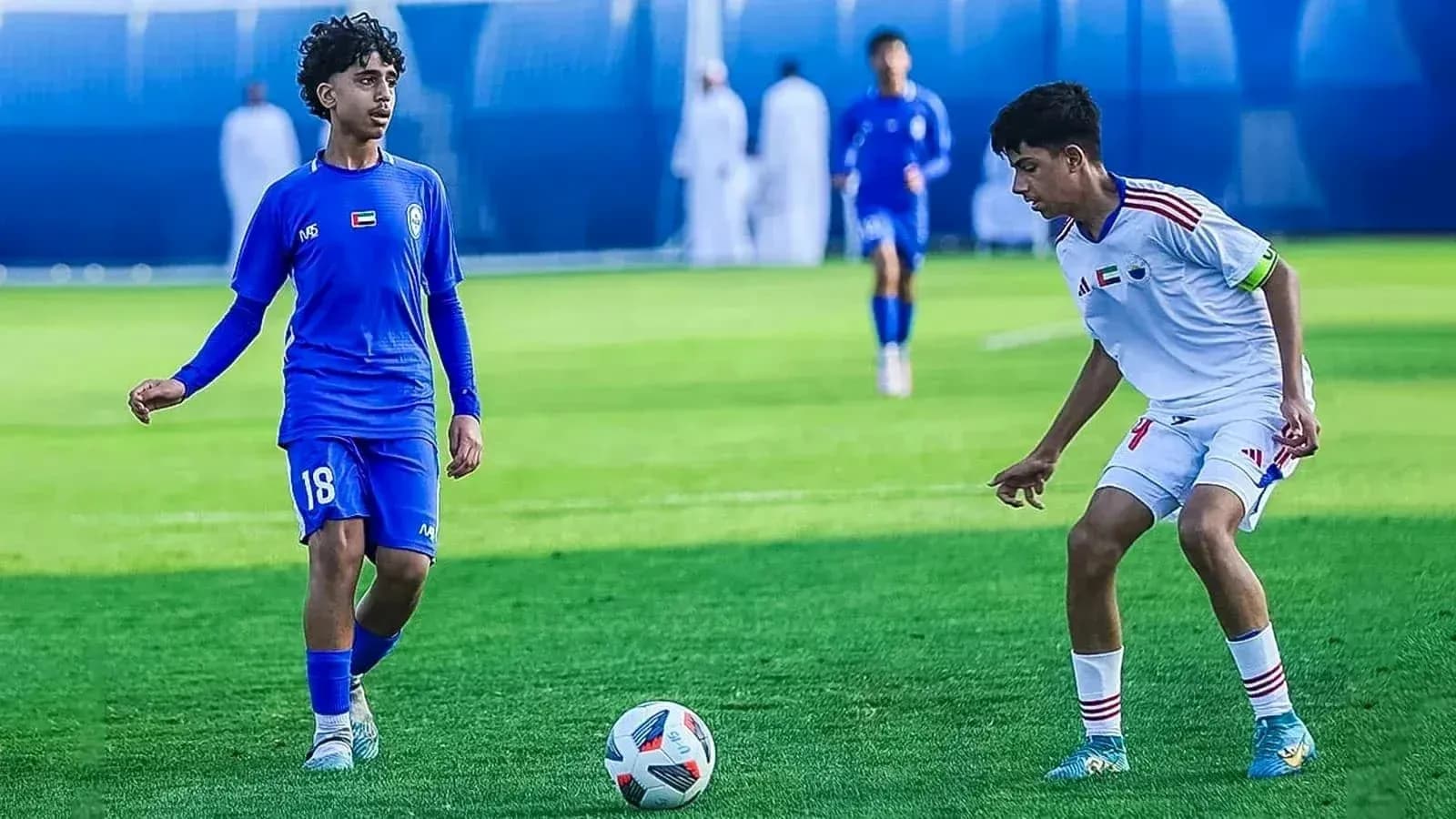 Al Nasr U23 player dribbling against Ajman U23