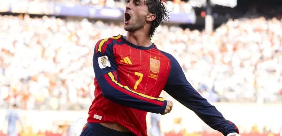 Player celebrating after scoring a goal for Spain