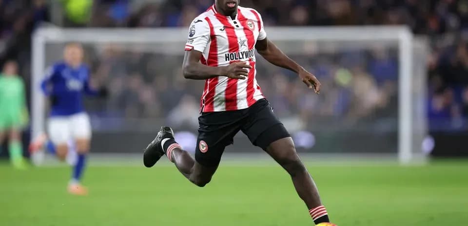 Brentford player running with the ball during match