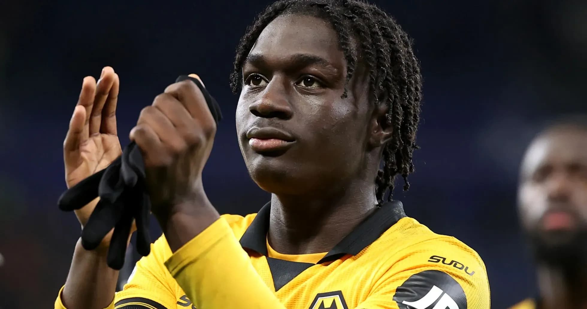 Player applauding fans in Wolves jersey