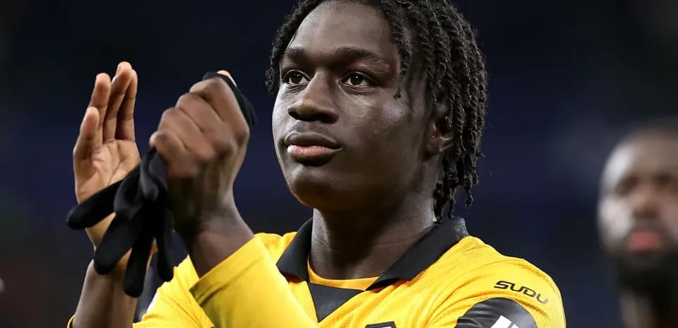 Player applauding fans in Wolves jersey