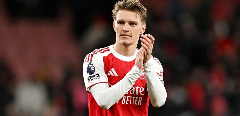 Player applauding fans after match at stadium