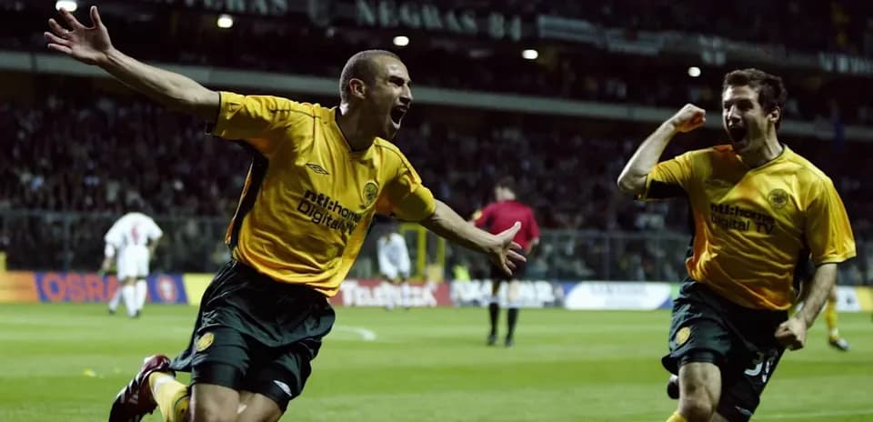 Players celebrating a goal on the field