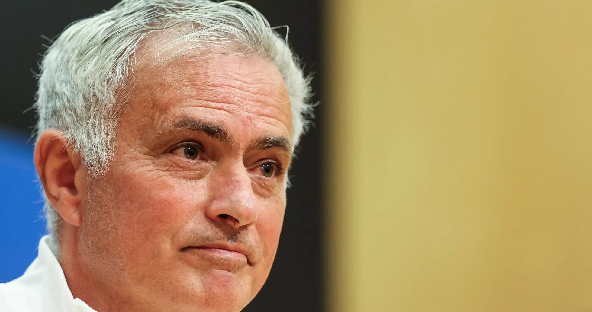 Coach speaking at a press conference