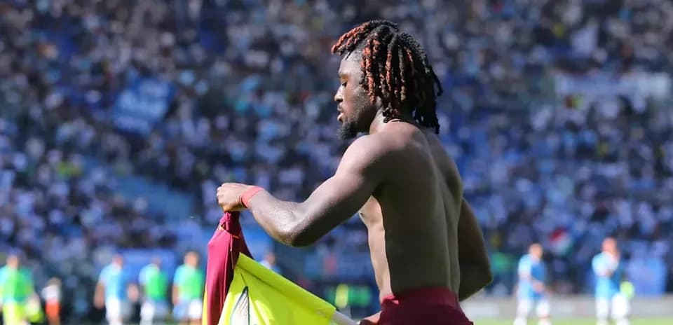 Player changing shirt on the field during match