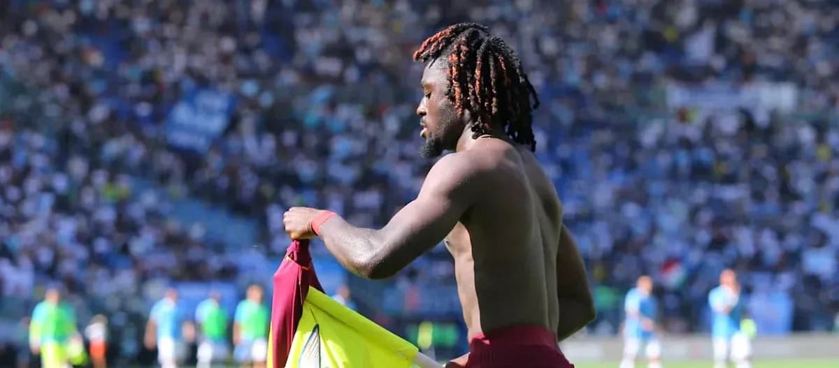 Player changing shirt on the field during match