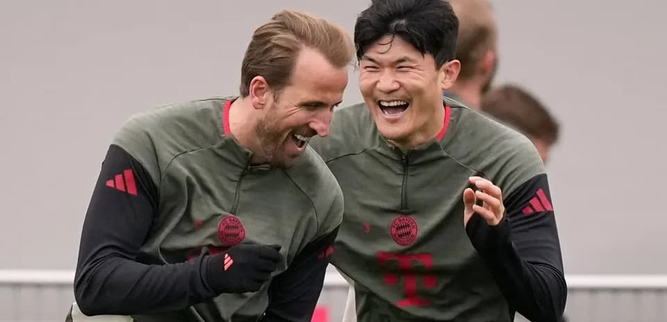 Two players laughing during Bayern Munich training session