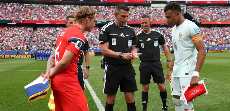 Captains and referees at coin toss before match
