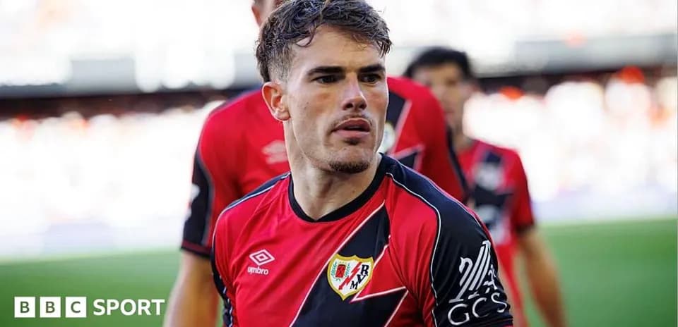Player in red and black jersey on the field