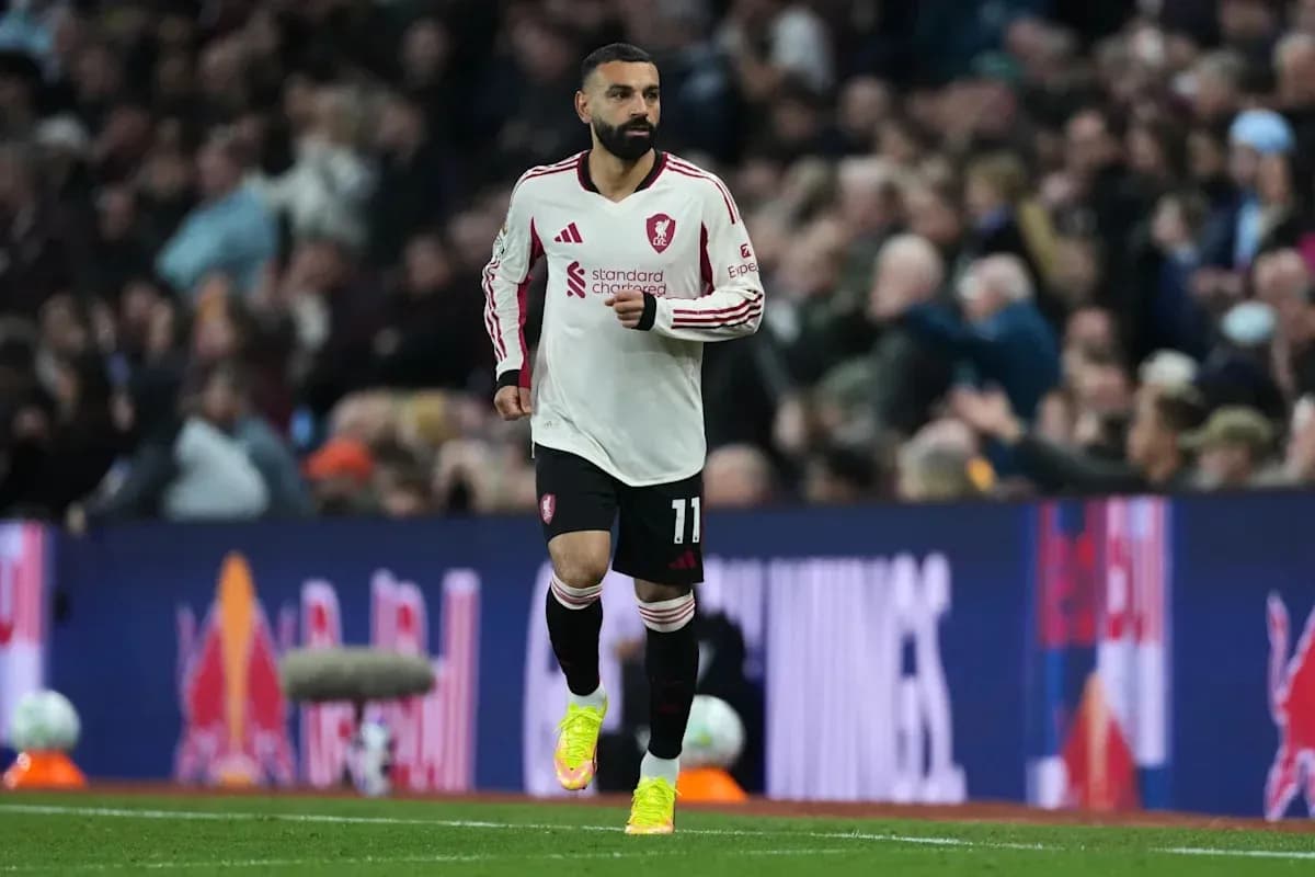 Player wearing Liverpool kit running on the pitch