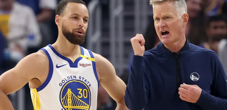Stephen Curry and coach Steve Kerr discussing strategy