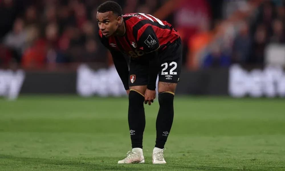 Player in Bournemouth kit resting during match