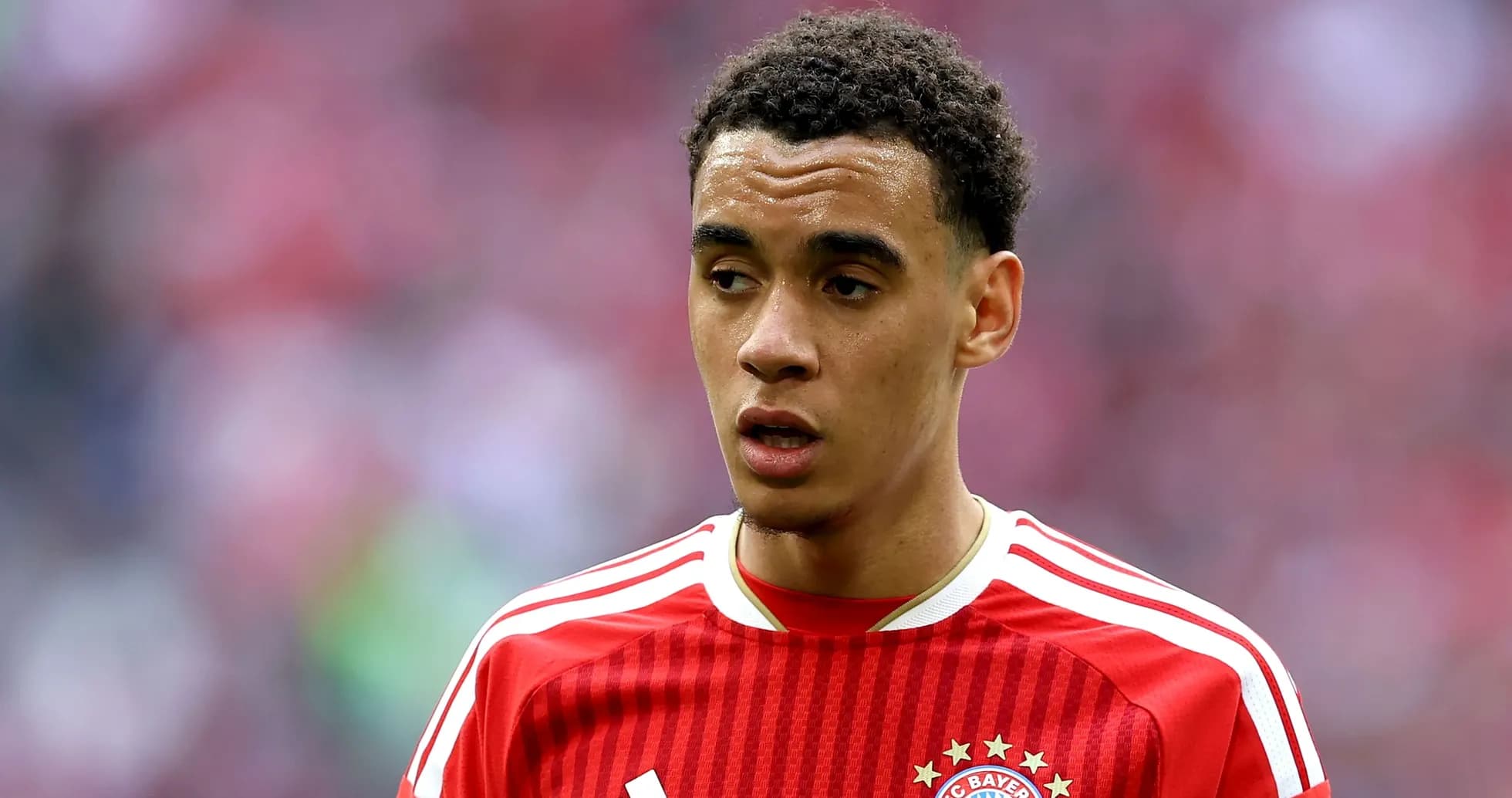 Player in red Bayern Munich jersey during match