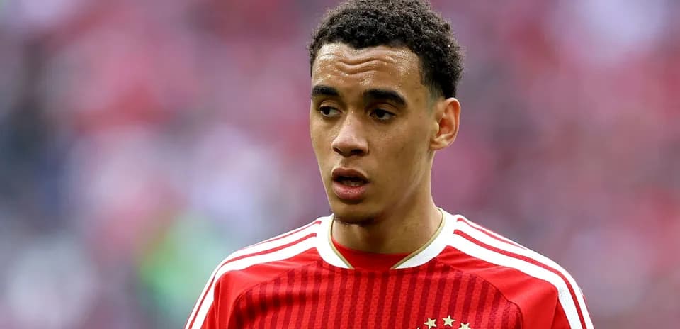 Player in red Bayern Munich jersey during match