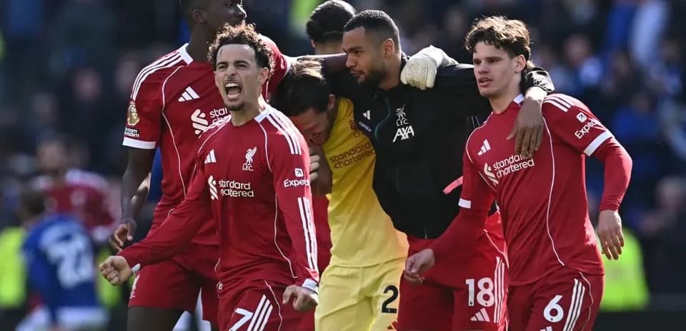 Liverpool players celebrating after a match victory