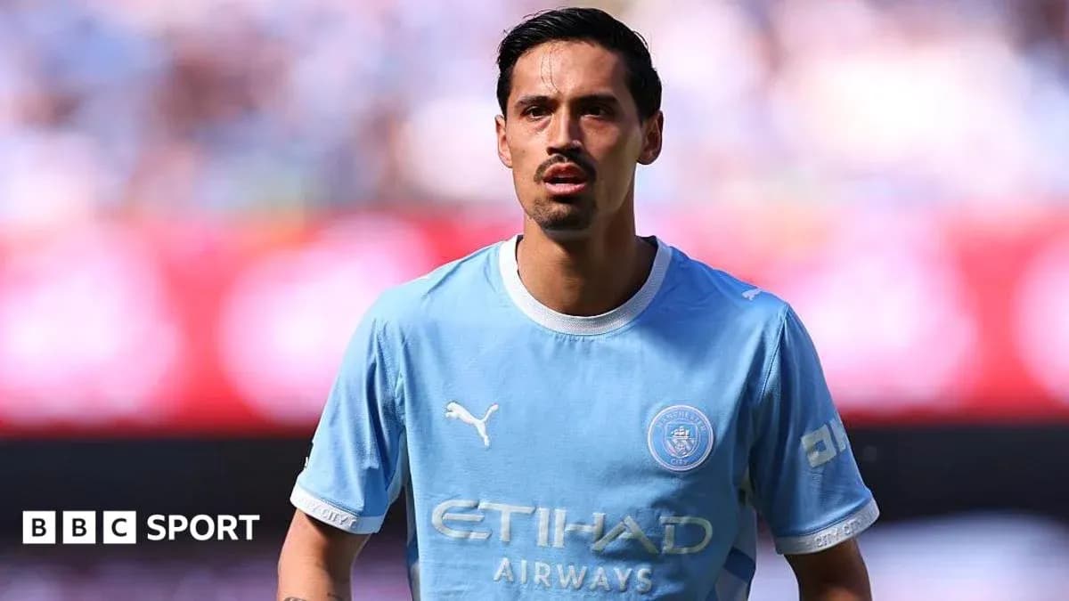 Player in light blue jersey during match warm-up